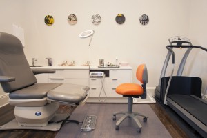 Treatment room with custom joinery and original artwork